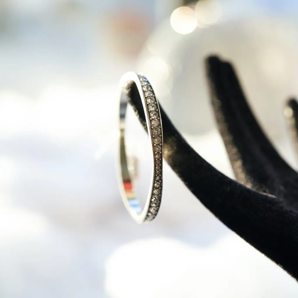 Bracelet set with clear stones on a black velvet stand